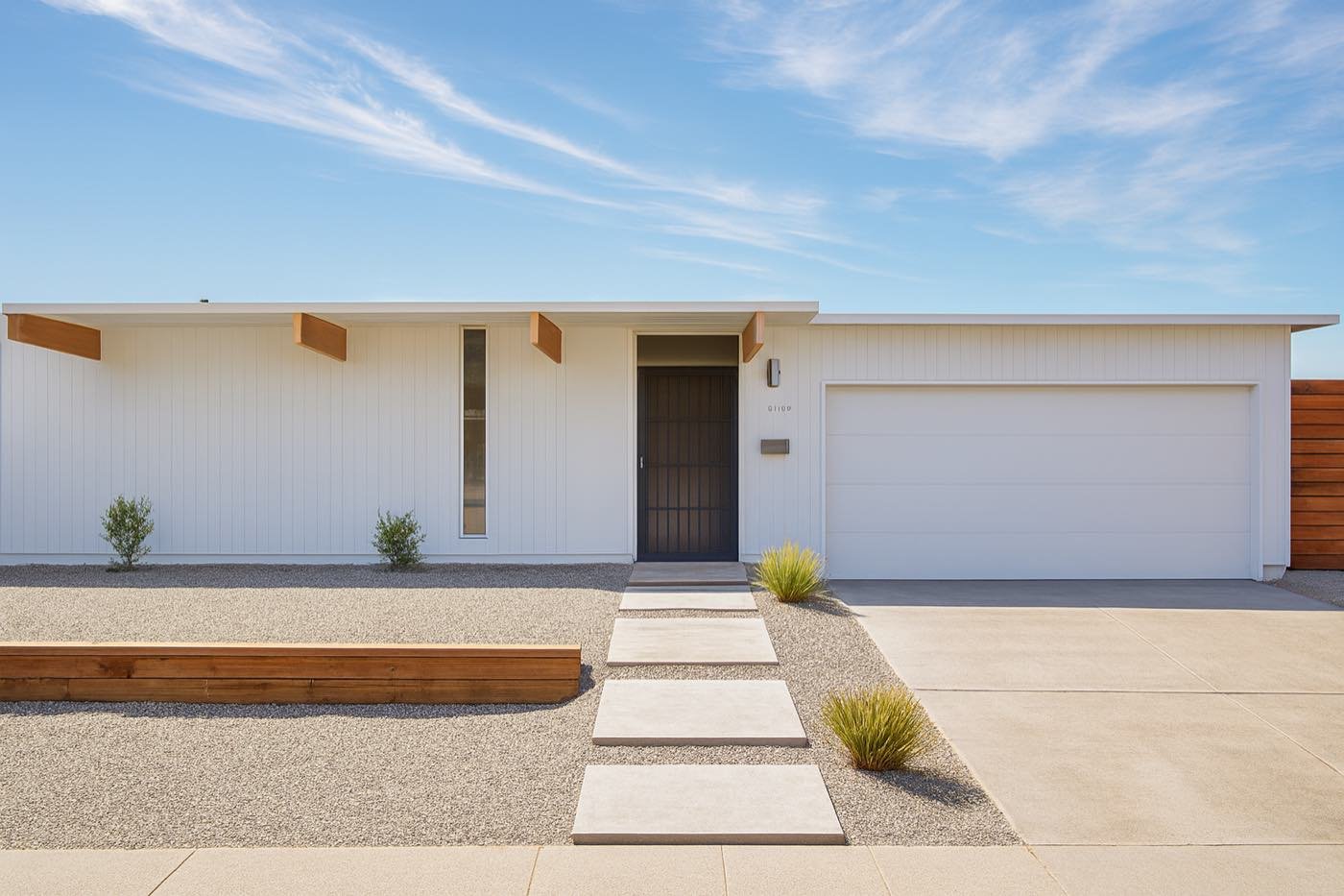 A white flat-roof Eichler with exposed beam tails and a drought-tolerant garden in Green Gables, Sunnyvale
