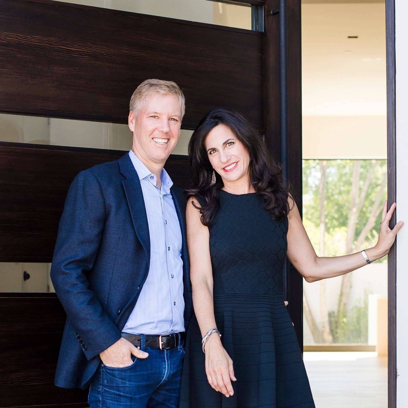 Eric and Janelle Boyenga at the entry of a modern home